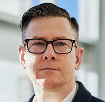 Portret van directielid Alexander Hughes, CEO van een cryptohandelsbedrijf